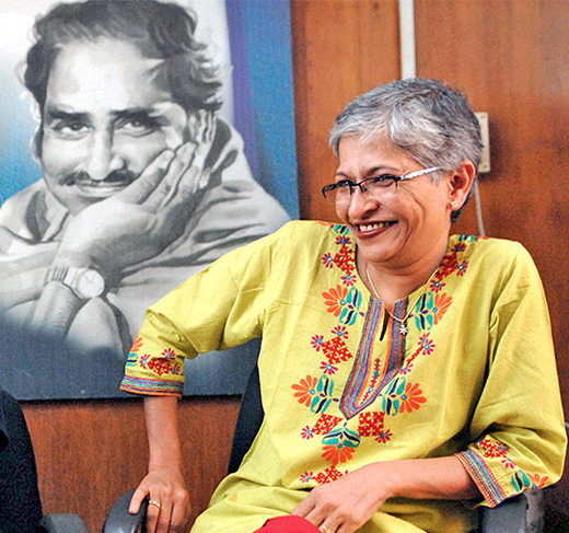 Gauri Lankesh under the portrait of her father P Lankesh